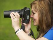 Battle Ground photographer Korie Accetta photographs a subject at Hockinson Meadows Park on April 21.