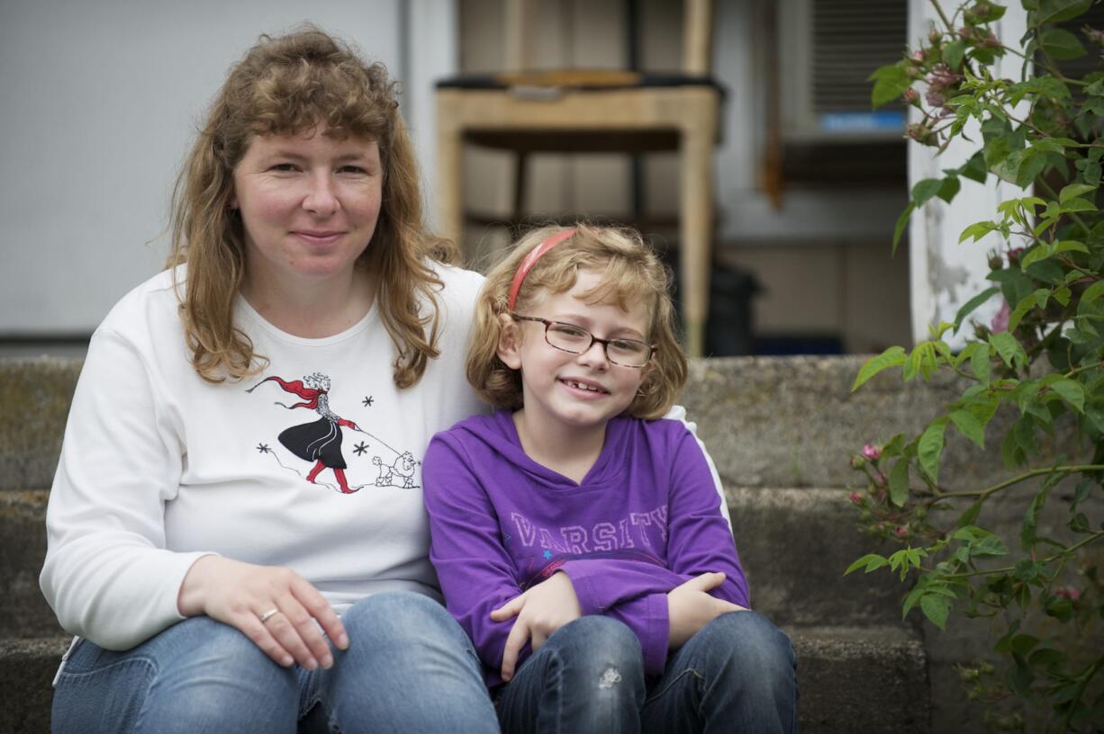 Steven Lane/The Columbian
Jennifer Smith of Vancouver worries changes to the state Medicaid managed care plans will mean her daughter, 7-year-old Bridget Smith, will need to find a new provider. Bridget, a Medicaid Basic Health member, is currently undergoing treatment for severe allergies. A provider change could disrupt Bridget's treatment, Jennifer Smith said.