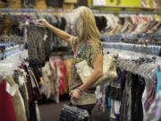 Theresa Curran of Boring, Ore., shops for summer clothes at Plato's Closet in Vancouver.