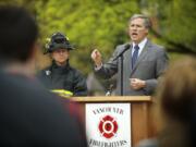 Democratic gubernatorial candidate Jay Inslee speaks to firefighters and firefighter representatives at a rally for the Inslee campaign on Tuesday at Esther Short Park in Vancouver.