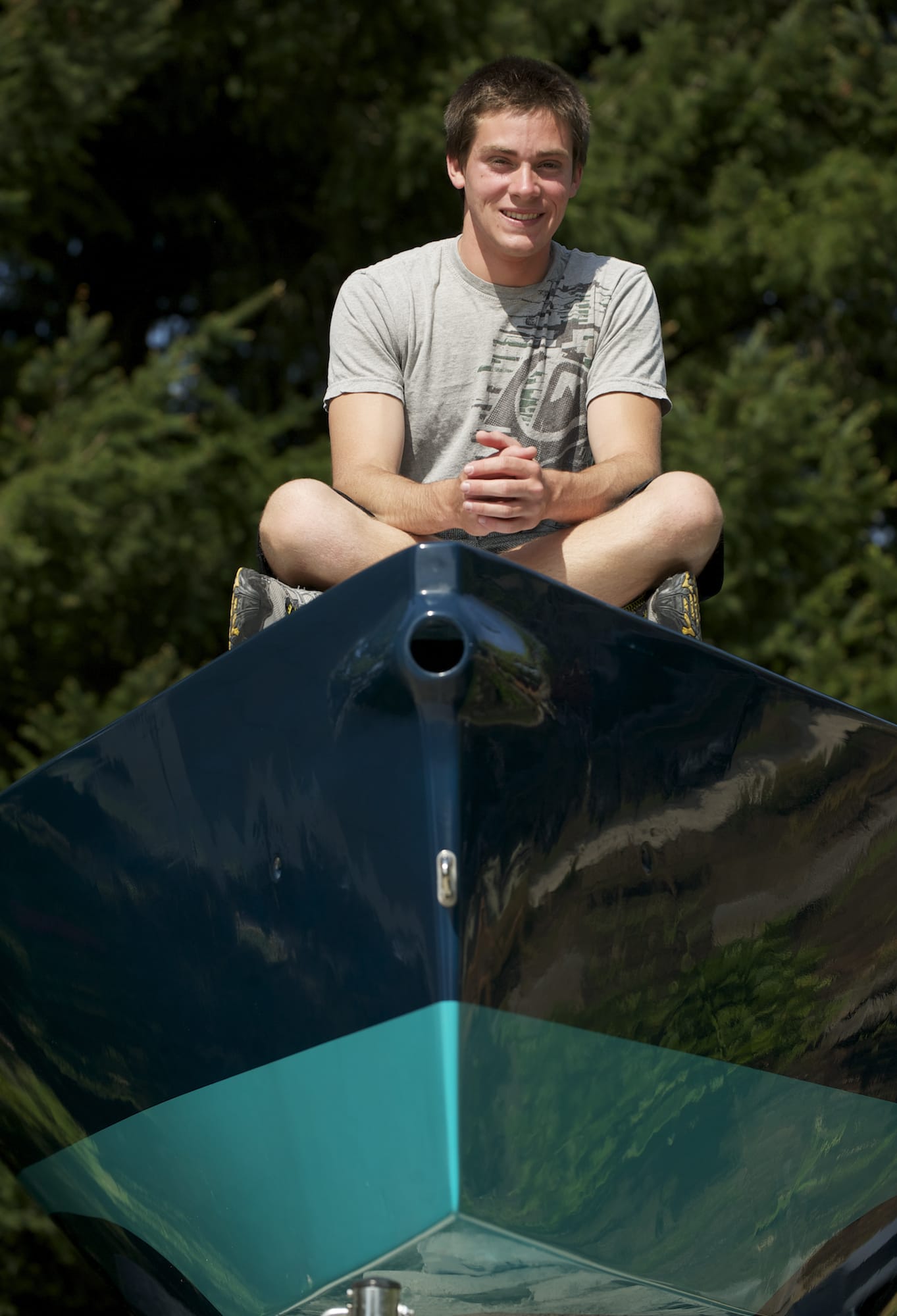 Camas High School senior Stephen Moran sits atop his i550 racing sailboat Friday afternoon.