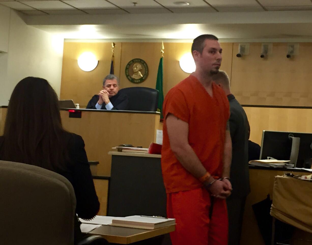 Alex J. Wright, 30, makes a first appearance Friday in Clark County Superior Court on suspicion of 18 counts related to child pornography. Wright has been an employee with Vancouver Public Schools since 2010.