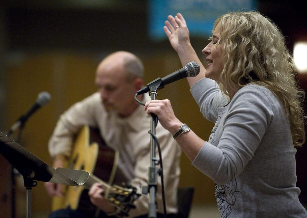 Becky Manuel leads the worship portion of a 30-plus singles group at Crossroads Community Church.