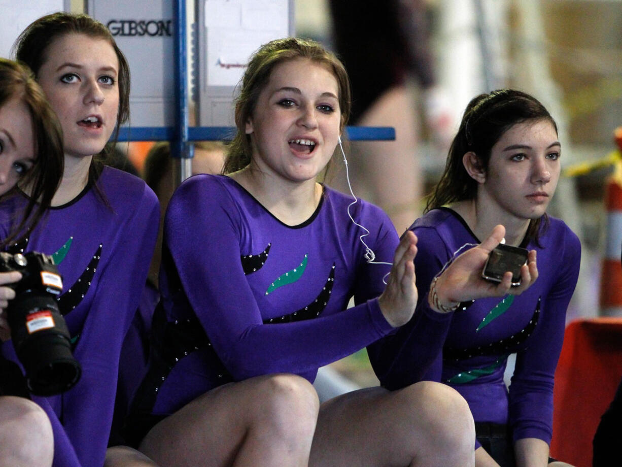 Steve Dipaola/For the Columbian
One of the top gymnasts in the state, Britni Atwell puts as much passion into helping her teammates succeed.