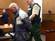 Ronald Ahlquist is taken into custody Thursday evening after a Clark County Superior Court jury found him guilty of manslaughter, identity theft and theft charges following a two-week trial.