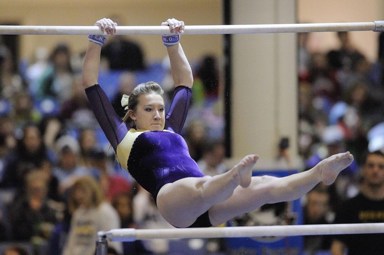 Jennifer Debellis of Columbia River High School scored a 9.4 on the uneven bars in the WIAA 3A gymnastics finals competition Saturday February 18, 2012 in Tacoma, Washington.