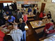 People take part in the seed swap and giveaway at Venersborg School in Battle Ground.