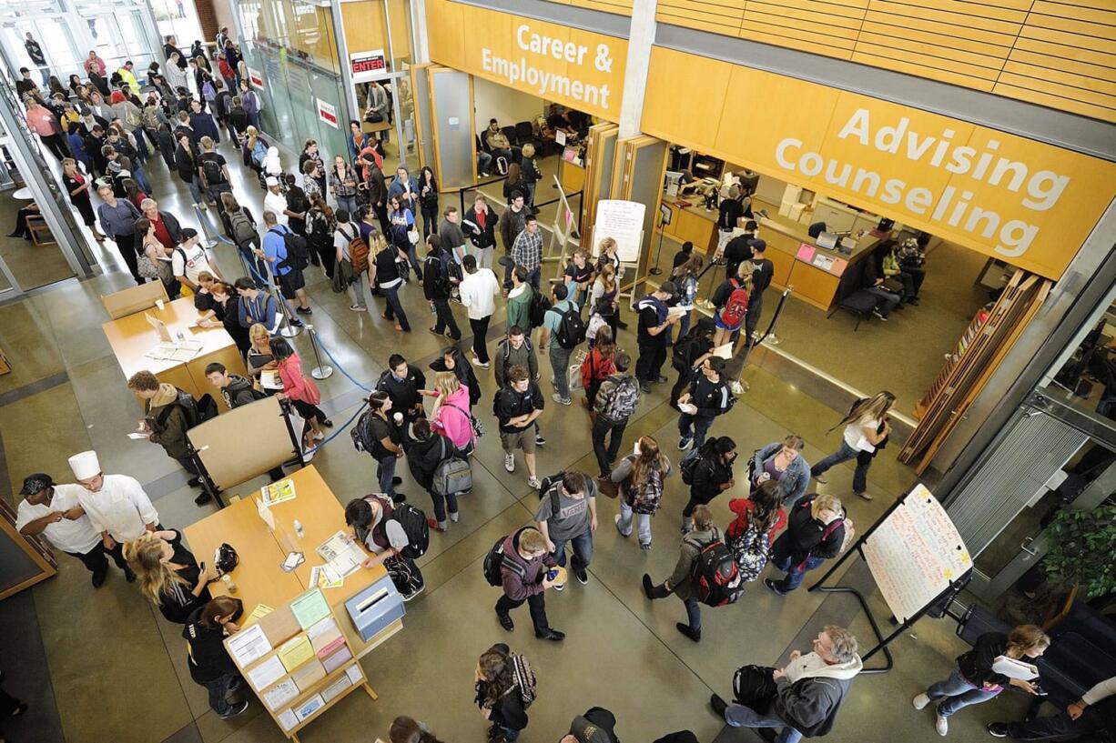 Clark College students negotiate long lines in Gaiser Hall during the first day of fall quarter Monday.