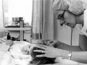 Almost like an assembly line, nurses shaved the heads of children so their cuts could be sutured.