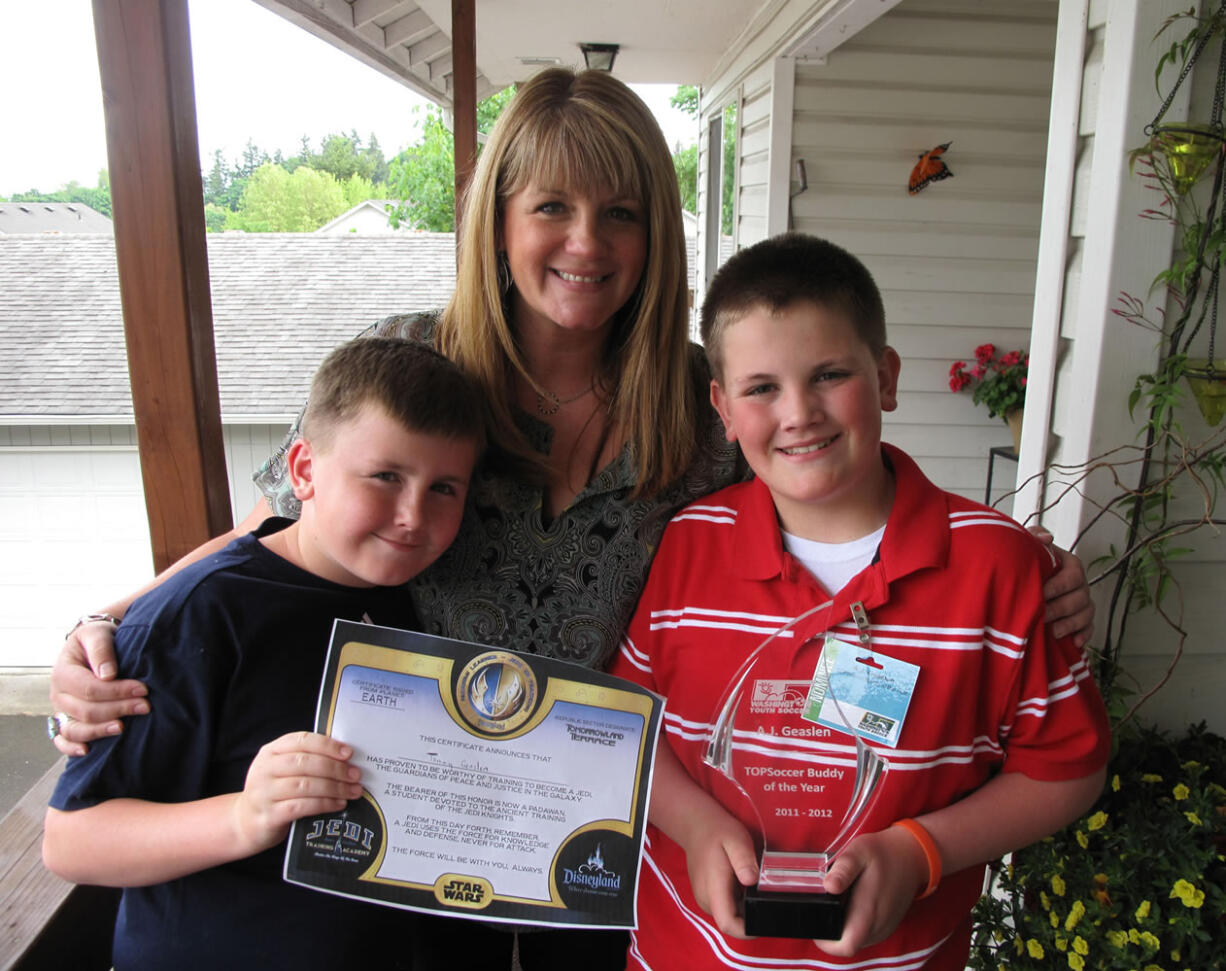 Camas: Brother Tommy, left, proud mom Molly and TOPSoccer Buddy of the Year A.J.