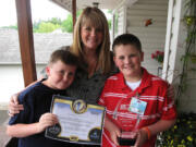 Camas: Brother Tommy, left, proud mom Molly and TOPSoccer Buddy of the Year A.J.