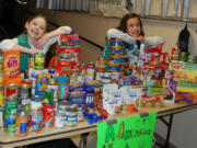 West Hazel Dell: Kayl Peck, left, and Beth Castellani-Kelsay got the goods to share.