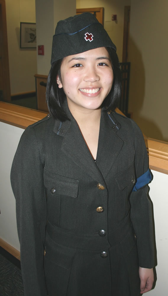 Columbia Way:  Lisa Zeta, a Mountain View High School junior, models a 1918 Red Cross volunteer uniform.