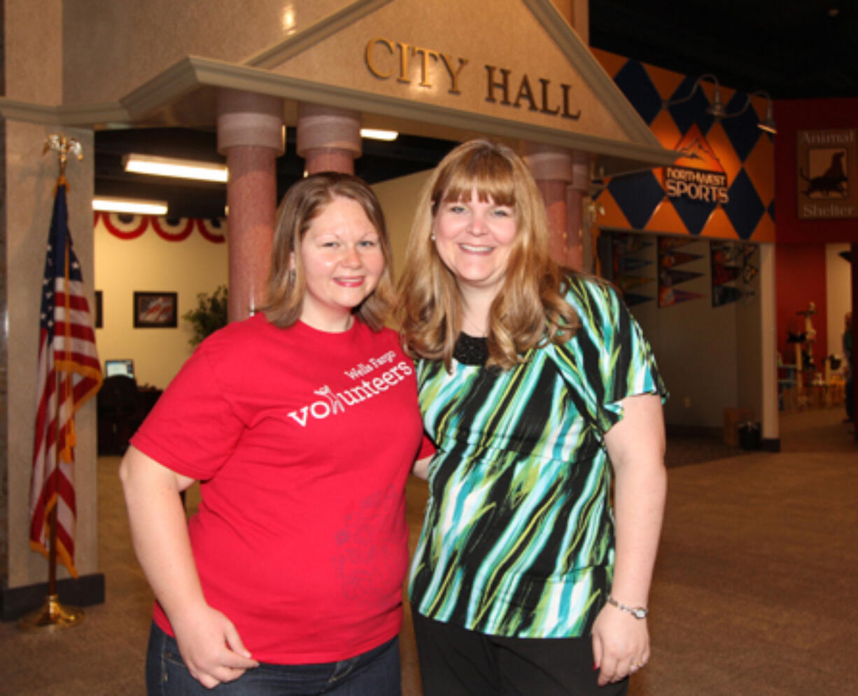 East Vancouver: Samantha Itkin, left, and Barbara Smith of Junior Achievement smile in front of J.A.