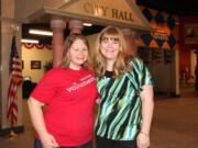 East Vancouver: Samantha Itkin, left, and Barbara Smith of Junior Achievement smile in front of J.A.