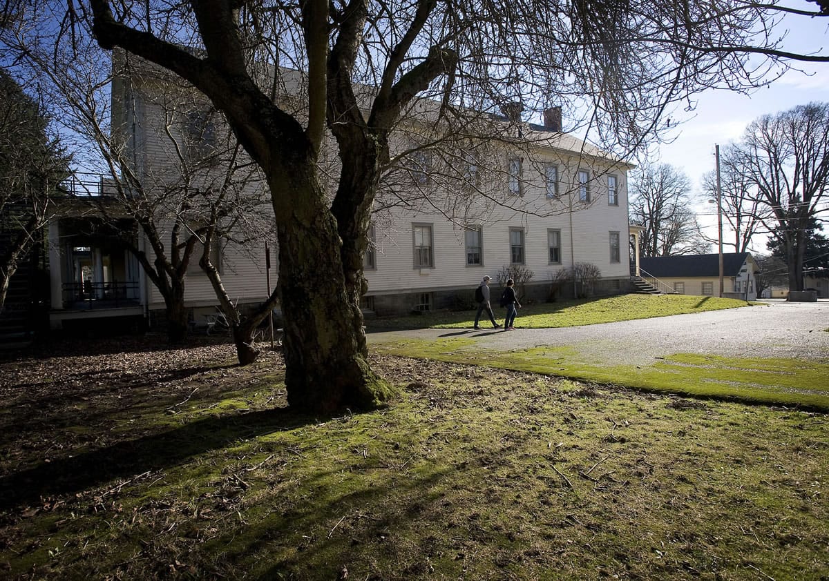 Clark College students (from left) Kenta Takao, 17, and Sunny Pisano, 17, take a walk past the Vancouver Barracks while on a break from classes on Monday February 6, 2012.