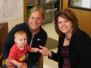 Battle Ground: From left, Laura McBride, holding her son Kellan, nine months, is grateful to school nurse Renee Klein, who saved Kellan from choking on April 24.