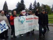 Hudson's Bay: Combat veteran and Clark County Special Olympics Washington sports coordinator Rick Cook, led the Special Olympics athletes, unified partners, coaches and families in the Veterans Day Parade on Nov.