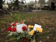 Two dozen roses sit at the curb outside 3275 F Place in Washougal on Sunday.