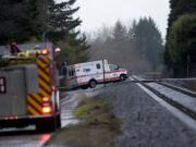 An ambulance leaves a private dock carrying Ana R. Ramos, 30, of Vancouver, who reportedly jumped from the northwest side of the I-205 bridge shortly after 1 p.m. Friday.