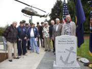 Thirteen former Merchant Marine sailors gather Wednesday to remember the seamen lost in World War II.