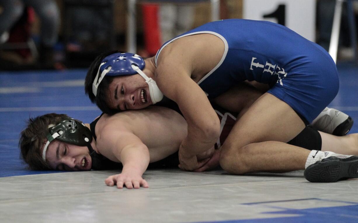 Will Taisacan (right) of Mountain View went from a first-time wrestler as a freshman to a two-time placer at state as he entered his senior season.