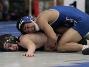 Will Taisacan (right) of Mountain View went from a first-time wrestler as a freshman to a two-time placer at state as he entered his senior season.