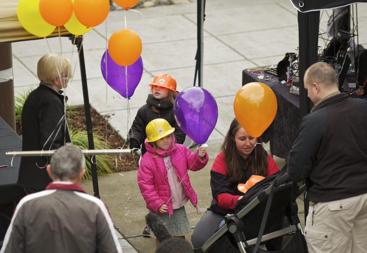 The Donaldson family -- from left, Audrey, 5, in orange hard hat; Mari, 4; mom Rosie; Devon, 18 months (in stroller); and D.T.