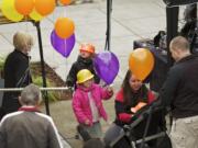 The Donaldson family -- from left, Audrey, 5, in orange hard hat; Mari, 4; mom Rosie; Devon, 18 months (in stroller); and D.T.