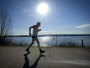 Jim Scheer, who turns 70 on Tuesday, runs along the Waterfront Renaissance Trail in Vancouver on Thursday.