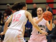 Teague Schroeder of Camas (right) tries to navigate the ball around Mountain View&#039;s Kathleen Hurst at a basketball game at Camas High School, Friday January 15, 2016.