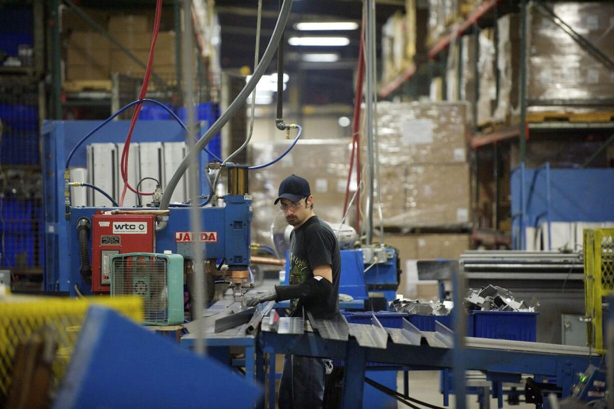 Patrick Wizniewski works the assembly line at Cadet Manufacturing in Vancouver.