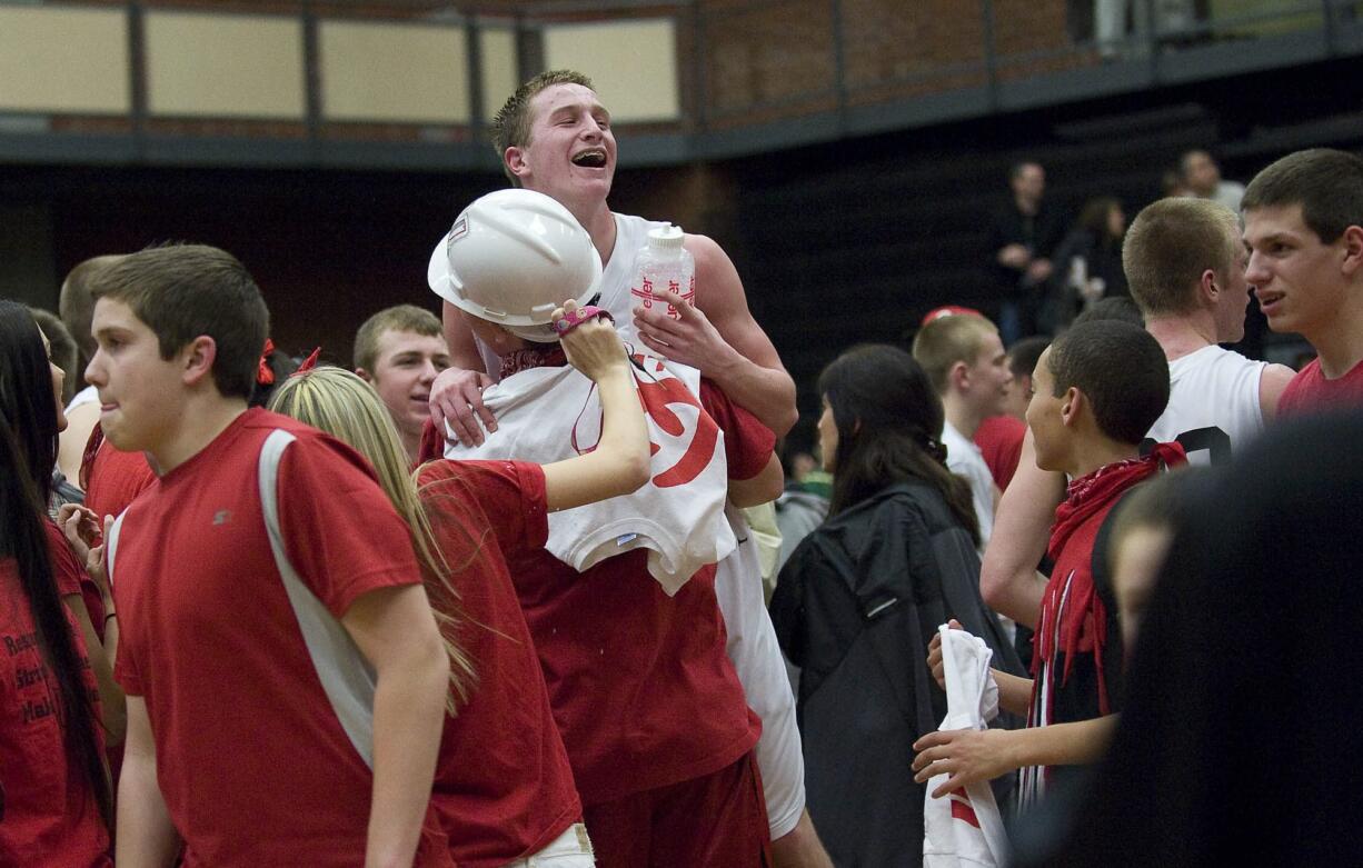 Union's Tyler Copp is lifted after a win against Evergreen and clinching the 4A GSHL league title at UHS on Friday February 3, 2012.