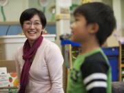 Yoshie Sano, assistant professor of human development at Washington State University Vancouver, interacts with her 5-year-old son, Reon Sano-Ochiai, at the WSUV Childhood Development Center.