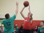 Matthew Pozsgai, 17, who has cystic fibrosis, puts up a shot in a YMCA recreational league.