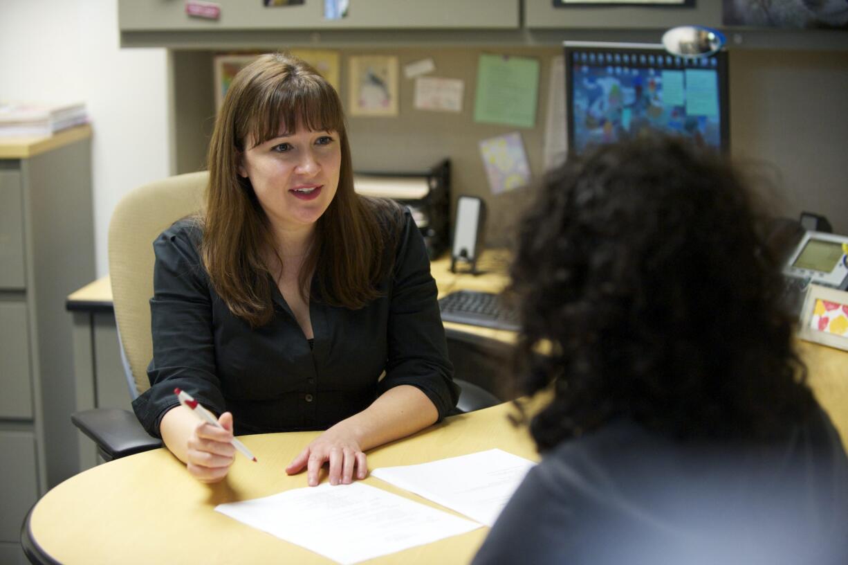 Washington State University Vancouver career counselor Christine Lundeen works with student Annise Nassib at the Student Services Center.