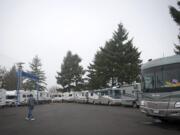 An employee of Bentley RV crosses the dealership's new location on a portion of the former Curt Warner Chevrolet site off Interstate 205 and Southeast Mill Plain Boulevard.(Zachary Kaufman/The Columbian)