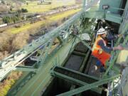 Marc Gross, bridge supervisor with the Oregon Department of Transportation, makes his way up the Interstate 5 Bridge lift tower last month.