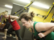 Janelle Hoyt, 47, works up a sweat during the TRX Suspension Training class at Flores Fitness.