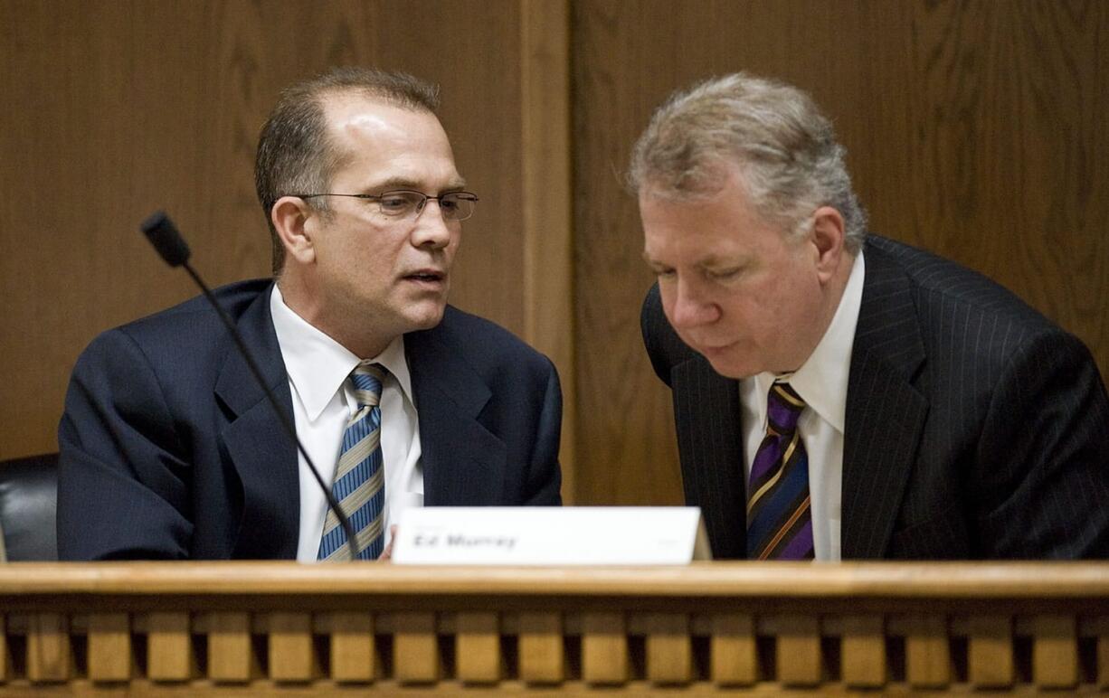 Ridgefield Republican Sen. Joe Zarelli, left, speaks with Seattle Democratic Sen. Ed Murray, chairman of the Ways and Means Committee, in February.