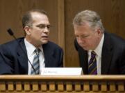 Ridgefield Republican Sen. Joe Zarelli, left, speaks with Seattle Democratic Sen. Ed Murray, chairman of the Ways and Means Committee, in February.