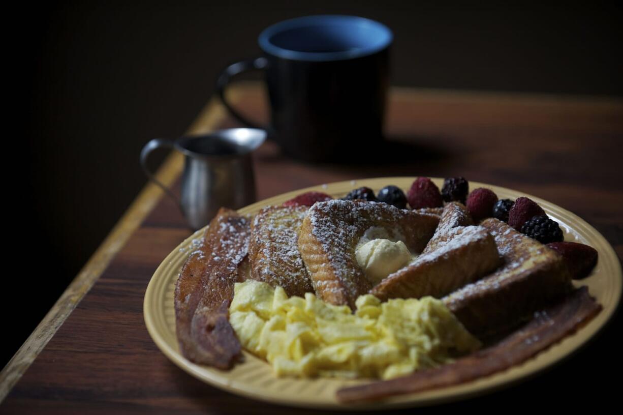 The Cinnamon French Toast 2x2x2 with Crispy Bacon and Eggs scrambled with coffee at Lisa's Country Kitchen.