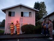 Firefighters investigate a fatal fire at 2900 H St.