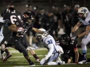 Camas' Zach Marshall runs against Meadowdale in the second half of their 3A quarterfinal playoff game at Doc Harris Stadium on Saturday.