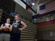 Exchange student Jenka Stiasna, right, poses for a portrait with her &quot;host sister&quot; Kendra Preuninger at Camas High School on Tuesday.