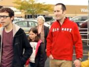 A group in a Walmart parking lot sings &quot;The Dream of the Suburbs is Alive in Vancouver&quot; in a scene from &quot;Vancouvria.&quot;