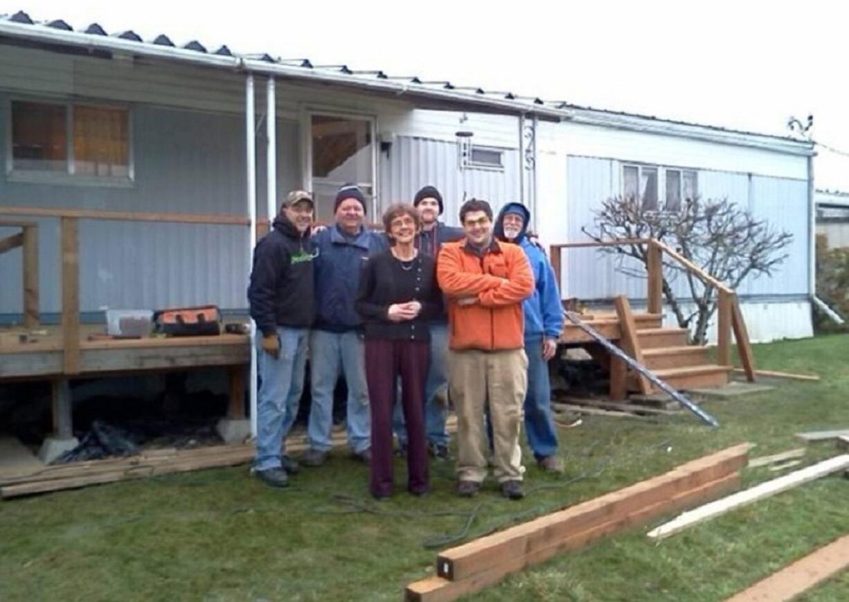 Northeast Hazel Dell: Volunteers from Lowe's and Habitat for Humanity's A Brush with Kindness program replaced Le Phare Community Help Center founder Cecile Roth's deck.