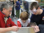 Salmon Creek: Volunteers from Vancouver's Smith-Root Inc. helped members of Boy Scout Troop 14 to build eight patrol boxes.