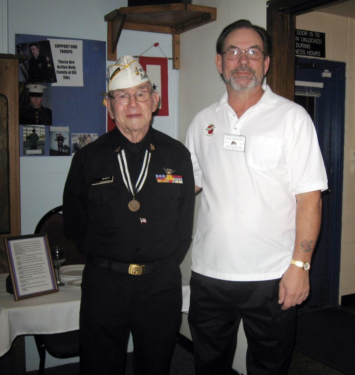 Battle Ground: George Bennett, left, chief radio man, patrol wing 2 VP 21 squadron, a Pearl Harbor survivor, and Battle Ground Elks Lodge Exalted Ruler Larry Childress, U.S.