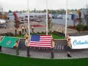 Hudson's Bay: Boy Scout Troop 328 assists in a flag pavilion dedication on Veterans Day at Columbia Machine Inc.